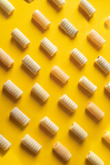  Huesos de Santo  pattern on yellow background. Traditional Spanish mazapan sweets for All Sant Day.