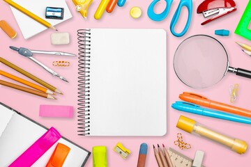 School supplies on a colored background. Creative layout with school stationery.