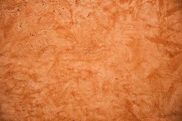 Terracotta colored plaster wall