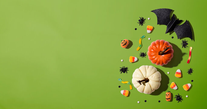 Pumpkins with Halloween decorations - overhead view flat lay