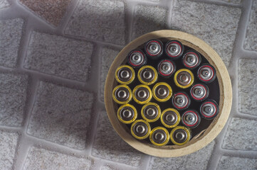 stacks viewed from above in a circle of tape, copy space and floor background