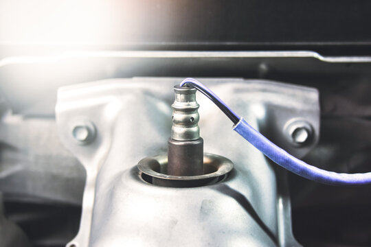 Oxygen sensor O2 on the header exhaust pipe for calculate mixing of engine ignition system in the car