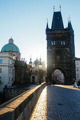 Obraz premium Empty street in Prague during Covid-19 time. Charles bridge in Prague in the morning, Czech Republic. Beautiful sunrise in Prague. 