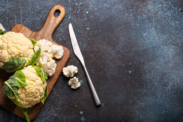 Fresh raw cut cauliflower with knife copy space