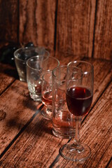 Bottles and glasses with wine on the table. Wine culture concept.
