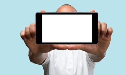 Excited Young Man Pointing On Smartphone With Blank Screen In His Hands,
