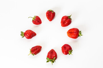 Red strawberries, arranged on a white background.