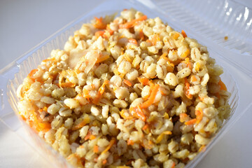 Boiled pearl barley with spices on a plate