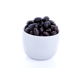 boiled black beans in bowl isolated on white background