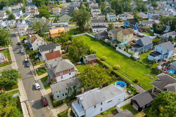 Fototapeta premium Aerial view of small streets residential area a small town in Sayreville New Jersey