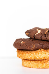 Coconut and chocolate cookies on a white background together
