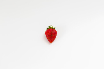 Delicious red strawberries, isolated on a plate. Background texture.