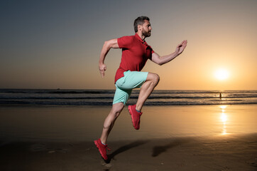 Fototapeta na wymiar athletic man runner running on sunset summer beach, athlete