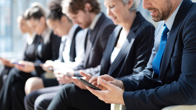 Diverse group of customers sitting in line, holding digital gadgets, using online apps and services on smartphone, laptops, tablets for work, checking messengers, chatting on social media. Banner