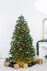 A large beautiful Christmas tree decorated with beautiful shiny trinkets and lots of different gifts on the floor.