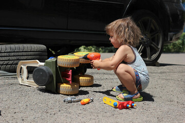 Boy repairing his toy car