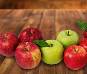 Group of tasty sweet fresh Apple on wooden board background, Fruits concept.