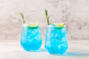 Refreshing blue drink or cocktail with ice