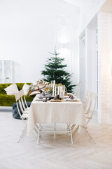 Cozy classic table for celebrating Christmas or New Year in a Scandinavian style.