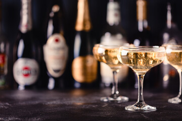 Champagne glasses on a dark background.