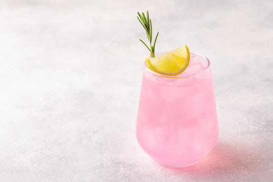 Refreshing pink drink or cocktail with ice
