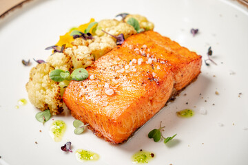 salmon steak with cauliflower and herbs