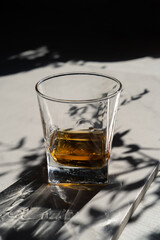 glass of whiskey on a black background