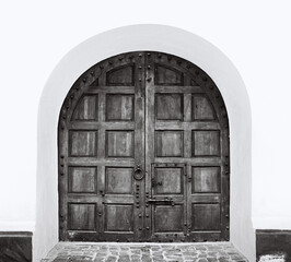 Ancient beautiful gate door. Black and white photo. 