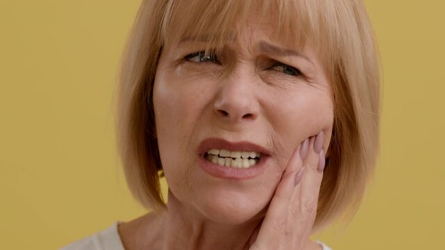 Acute Toothache. Closeup Shot Of Unhappy Senior Lady Suffering From Dental Pain
