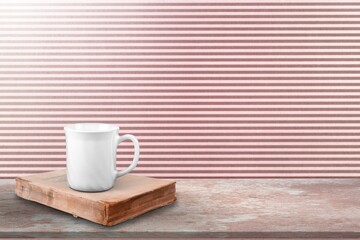 A coffee cup and book on wooden table. Back to school concept