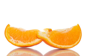 Two slices of organic ripe minneola, close-up, isolated on white.
