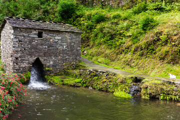 Os Teixois, a small ethnographic village in Taramundi. Rustic landscape in Asturias. Spanish historical site. Water reservoir.