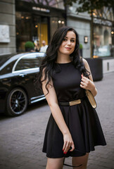 Fototapeta premium European Woman with dark hair and pale skin, in vintage style at city, fashionable outdoor portrait 