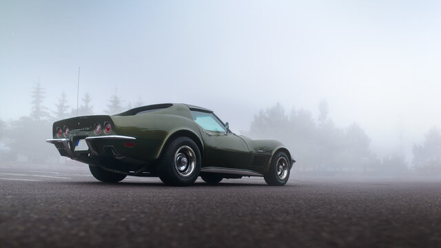 Brno, Czech Republic - October 25 2015: The legendary Chevrolet Corvette Sting Ray on a forest road in the cold and foggy autumn weather.