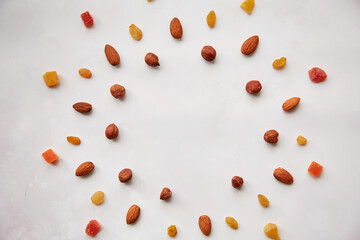 Creative food in shape of star with, hazelnuts, almonds, candied fruits and raisins. Vegan natural antioxidants food, healthy eating concept. Copy space