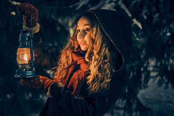 Young girl in winter forest fairy tale