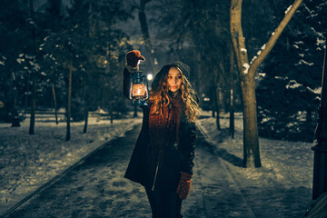 Fototapeta na wymiar Young girl in winter forest fairy tale