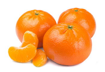 Sweet ripe tangerines and mandarin slices isolated on white background.