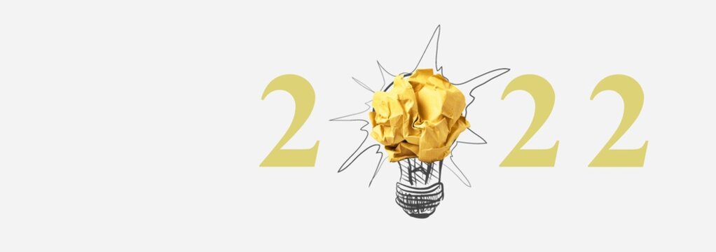 2022 creativity inspiration concepts with a light bulb on the background.