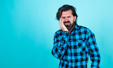 Fototapeta premium handsome guy hipster with moustache and beard suffer from toothache, stomatology