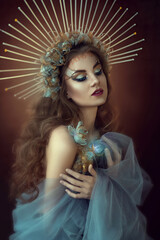 fantasy beauty girl princess in golden Beautiful vintage blue-blue dress. Historical woman lady...