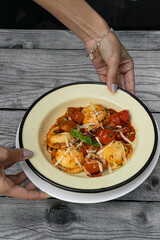 person holding pasta homemade