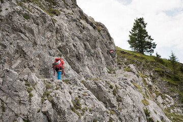 Mountaineer man climbs on top mountains