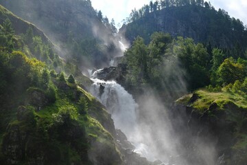 Fototapeta na wymiar A beautiful landscape with the Latefossen Waterfall and Espelandsfossen Waterfall in Norway