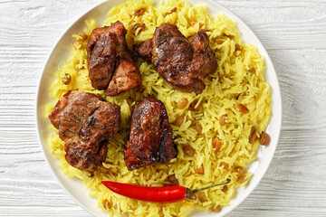 roasted meat served with raisins saffron rice