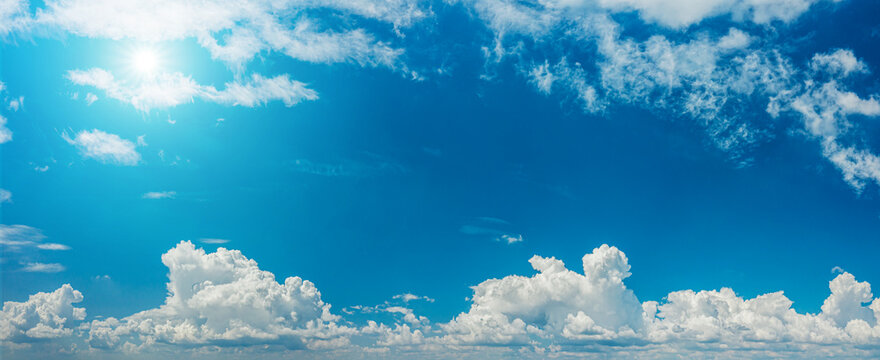 Deep blue sky and different types of white clouds in it. Beautiful nature background. © volff