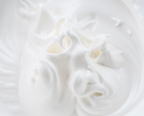 Creamy pics in yoghurt or cream surface. Top view.
