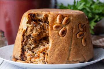 Turkish Perde Pilavi. Drape pilaf with chicken, almond and raisin. A local flavor Rice from Siirt region (Turkish name; Siirt perde pilavi)