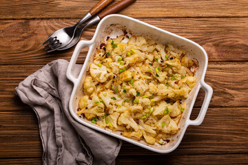 Baked cauliflower with herbs top view