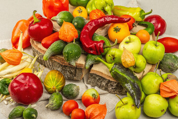 Fototapeta na wymiar Trendy ugly organic vegetables and fruits on stone concrete background